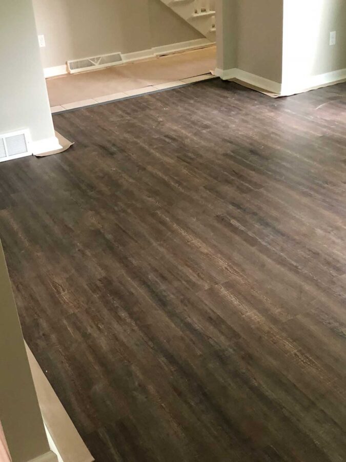 Gray wood-look plank flooring installation in a Poland, OH home