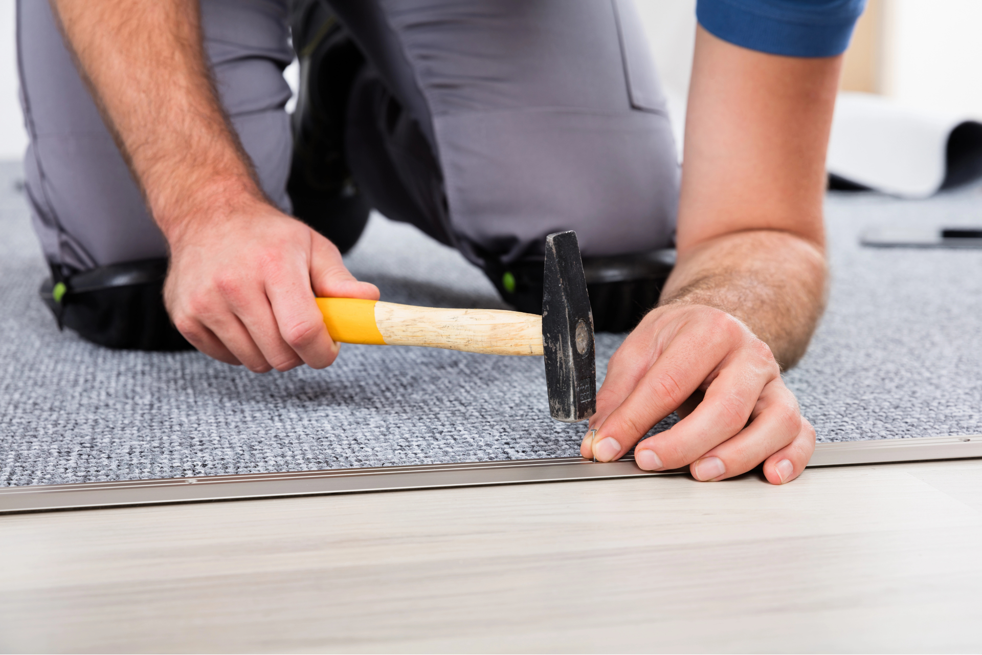 Specialist installing carpet for a home in Canfield, OH